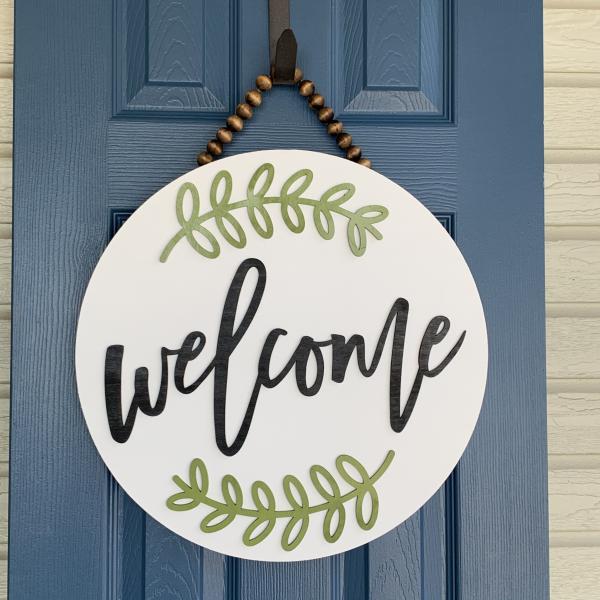 Welcome round Door sign With green laurel