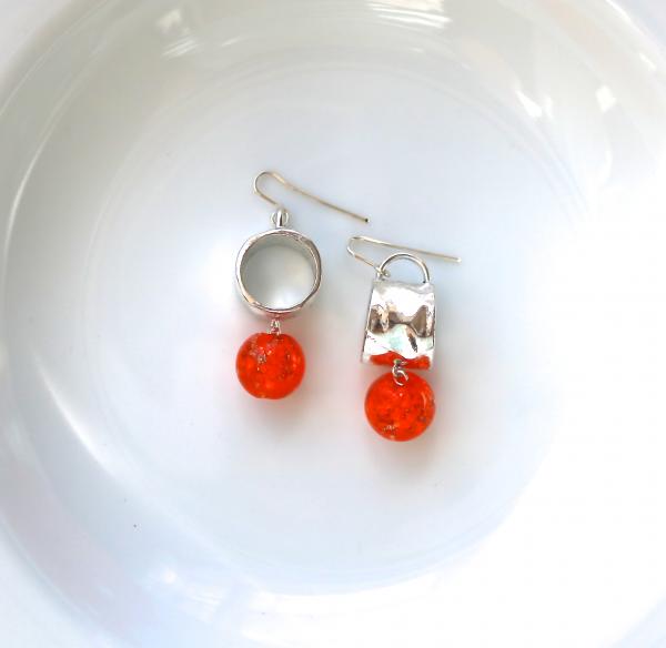 Silver drum and orange glaze ball earring