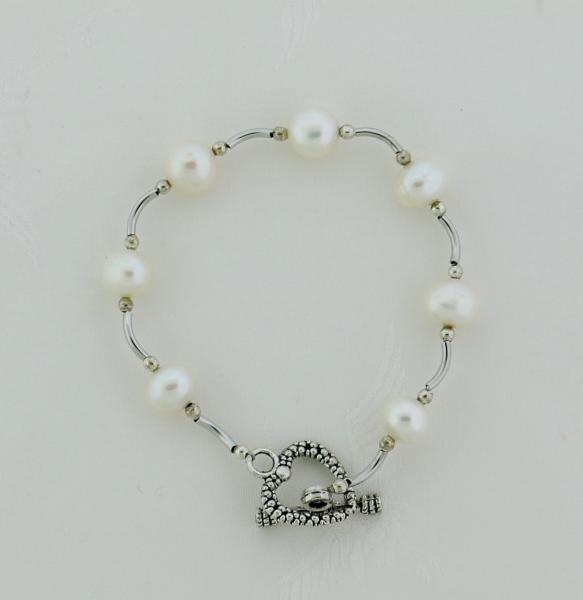 Curved silver tube and freshwater pearl bracelet picture