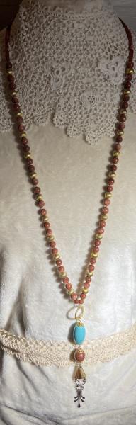 Long hand knotted necklace with goldstone picture