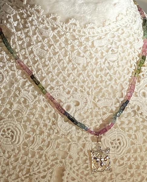 Watermelon tourmaline and .925 silver bee charm necklace.