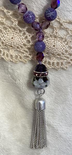 Long hand knotted necklace with purple frosted agate and crystal picture