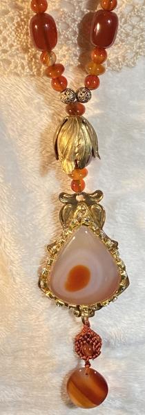 Long carnelian necklace with vintage brass picture