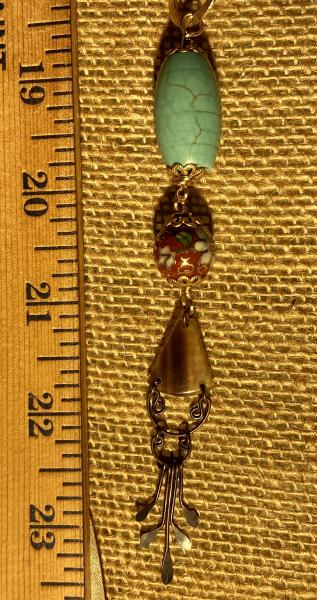 Long hand knotted necklace with goldstone picture