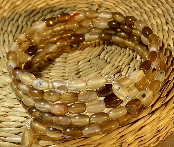 Quadruple coils  brown striped agate beads bracelet .