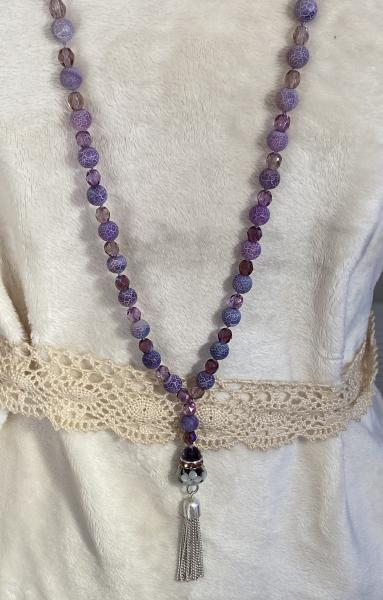 Long hand knotted necklace with purple frosted agate and crystal picture