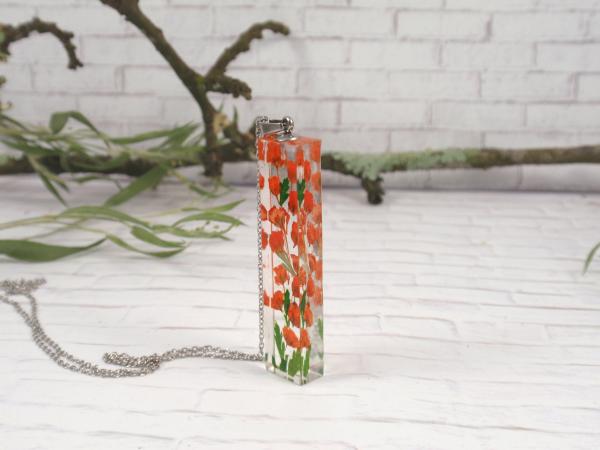 Terrarium Necklace with orange babys breaht flowers picture