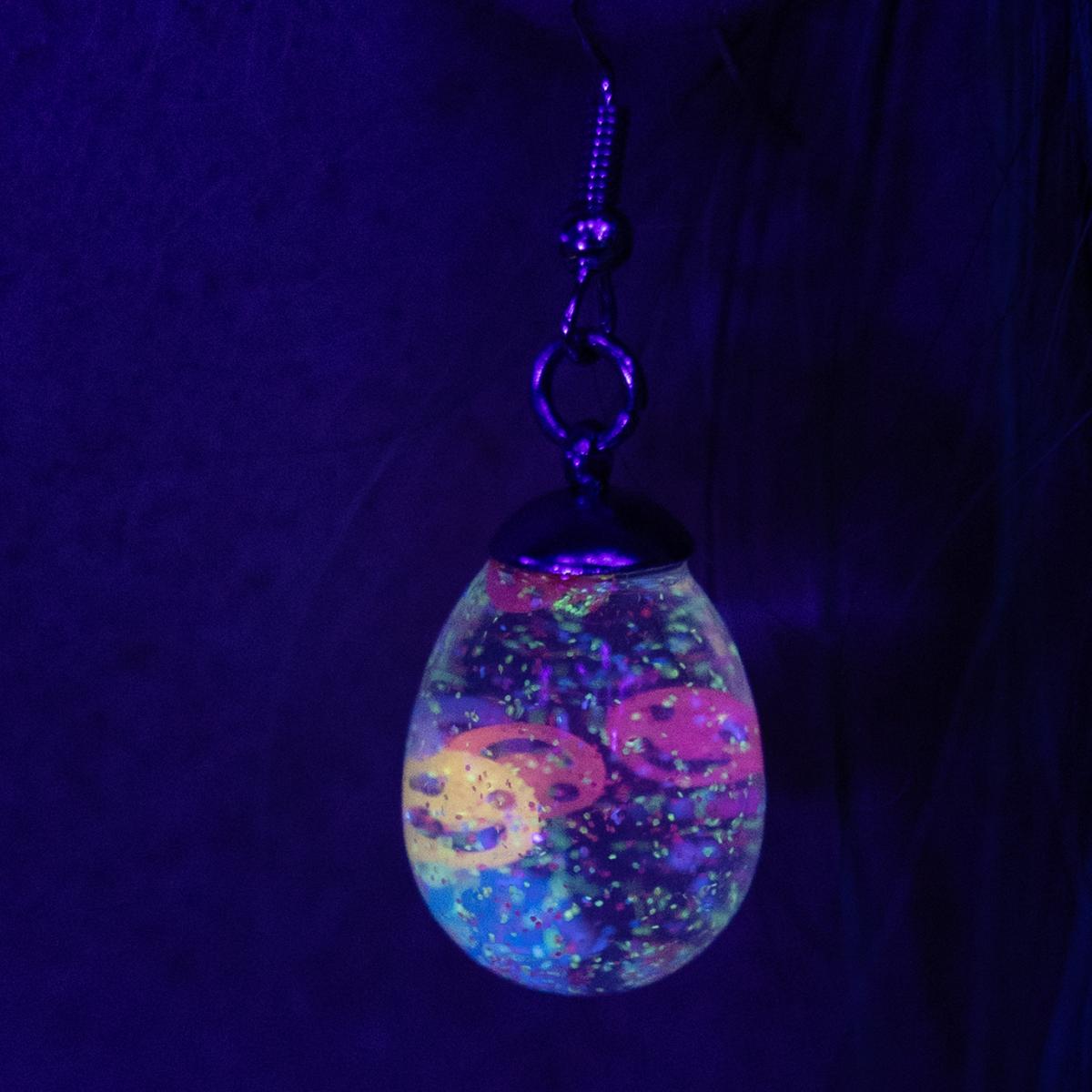 Neon glowing snow globe shaker jewelry picture