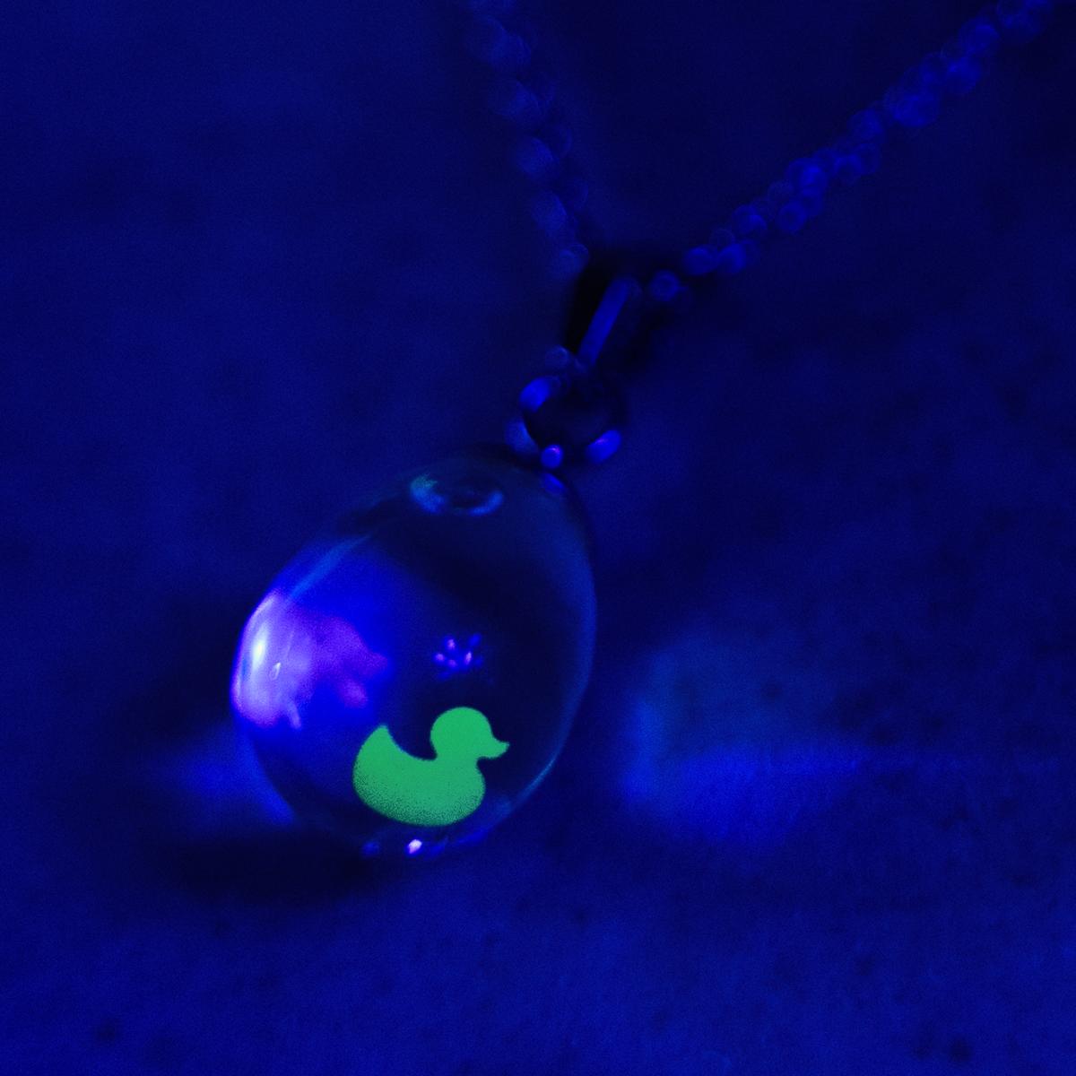 Neon glowing snow globe shaker jewelry picture