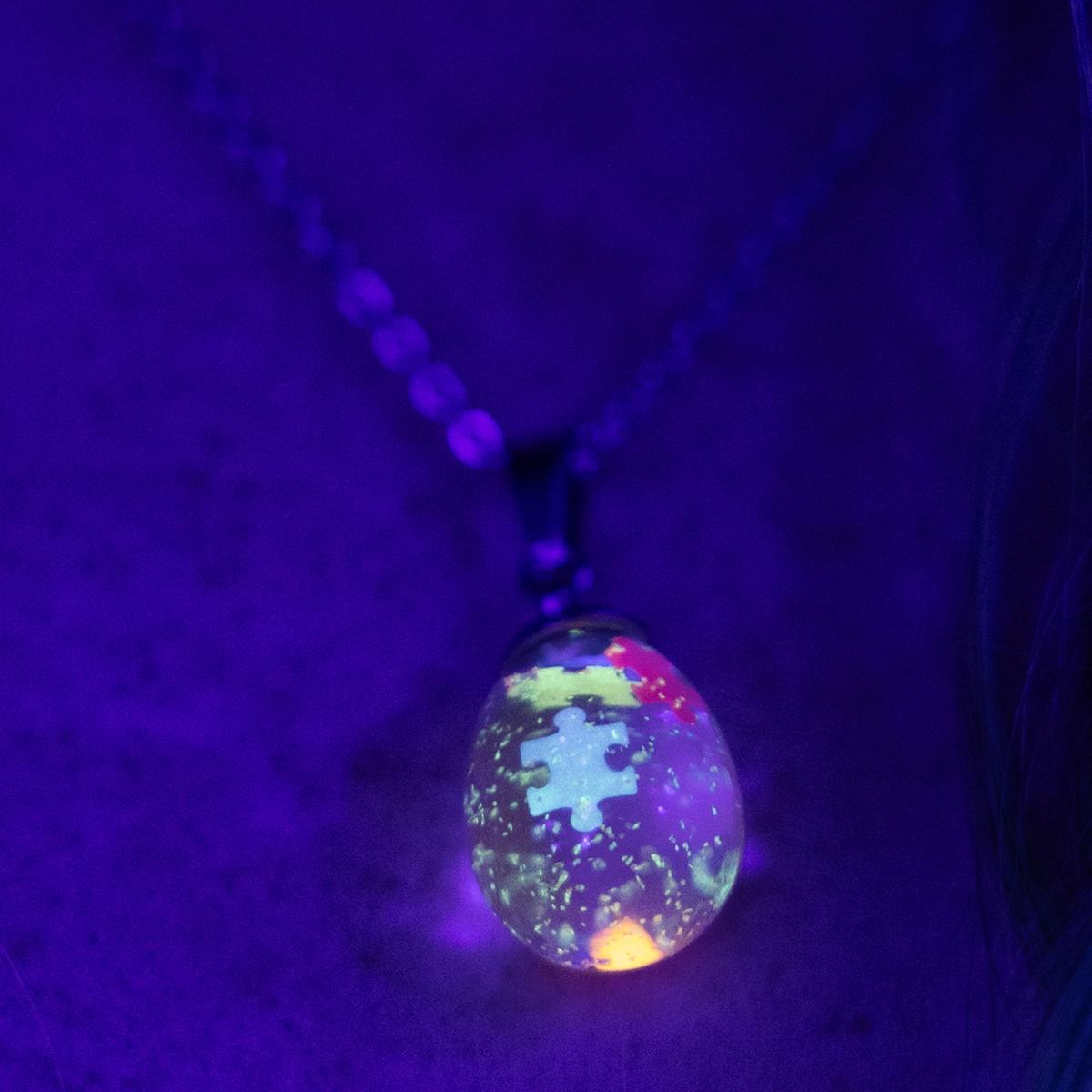 Neon glowing snow globe shaker jewelry picture