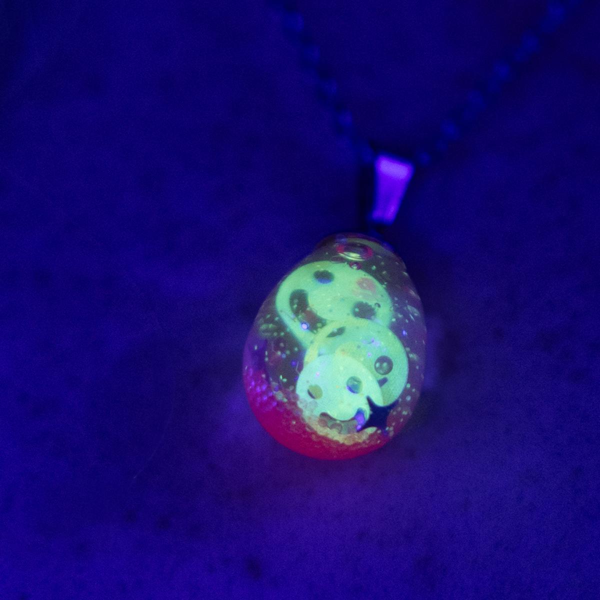Neon glowing snow globe shaker jewelry picture