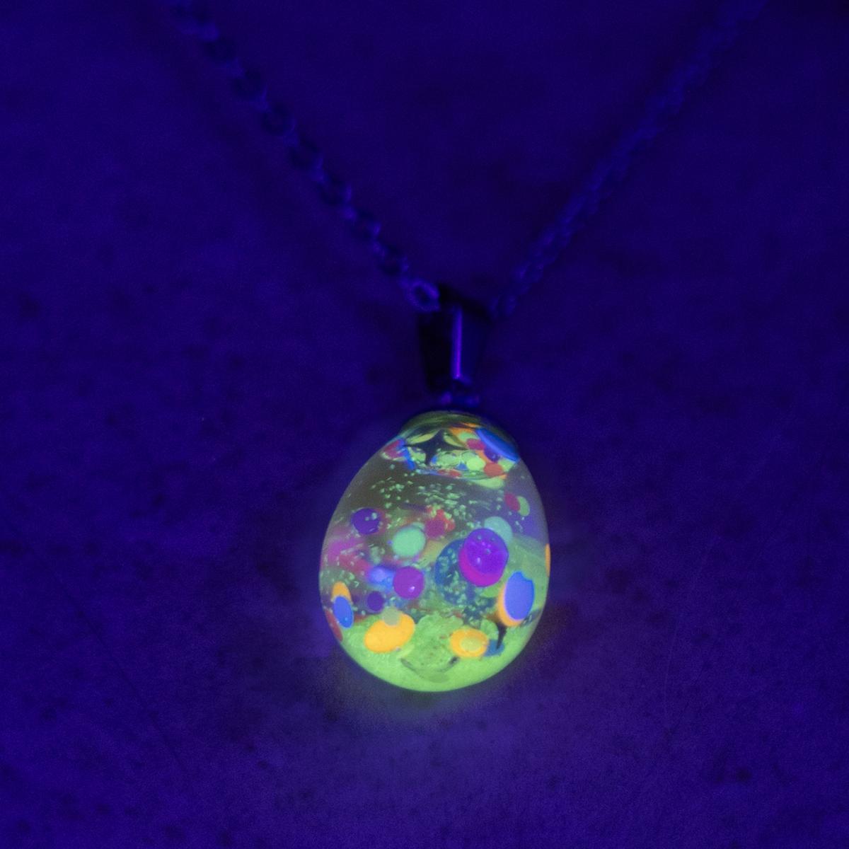 Neon glowing snow globe shaker jewelry picture