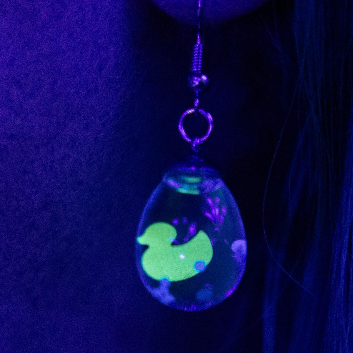 Neon glowing snow globe shaker jewelry picture