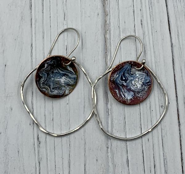 White and dark blue enamel in orbit earrings