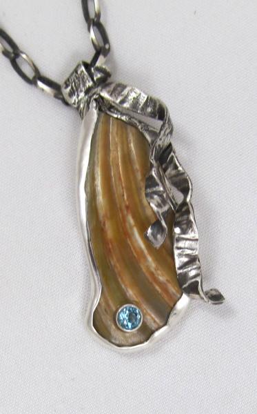 Sea Shell with blue topaz