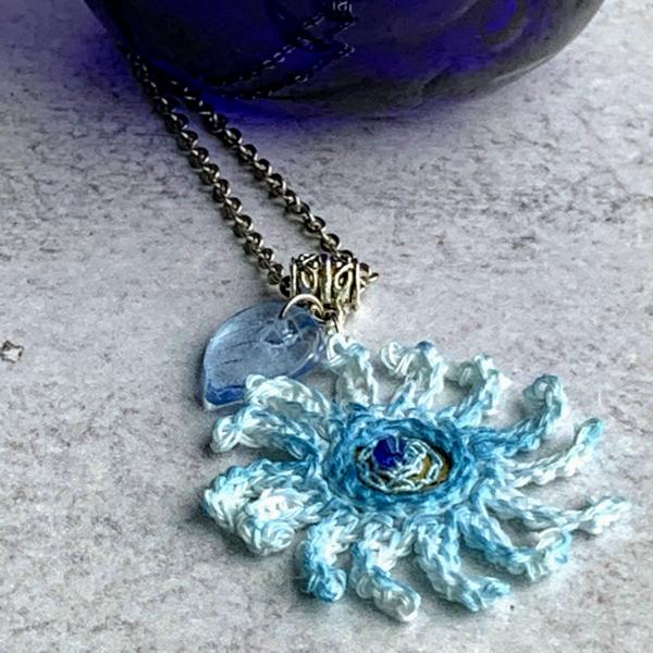 Sky Blue Mixed Media Flower Pendant - Crochet Linen Petals - Hand Painted - Embroidered Center - Glass Leaf - 24 inch Chain - One of a Kind picture