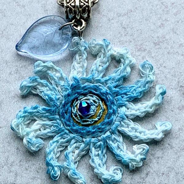 Sky Blue Mixed Media Flower Pendant - Crochet Linen Petals - Hand Painted - Embroidered Center - Glass Leaf - 24 inch Chain - One of a Kind picture