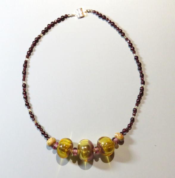 Three hollow beads on garnet picture