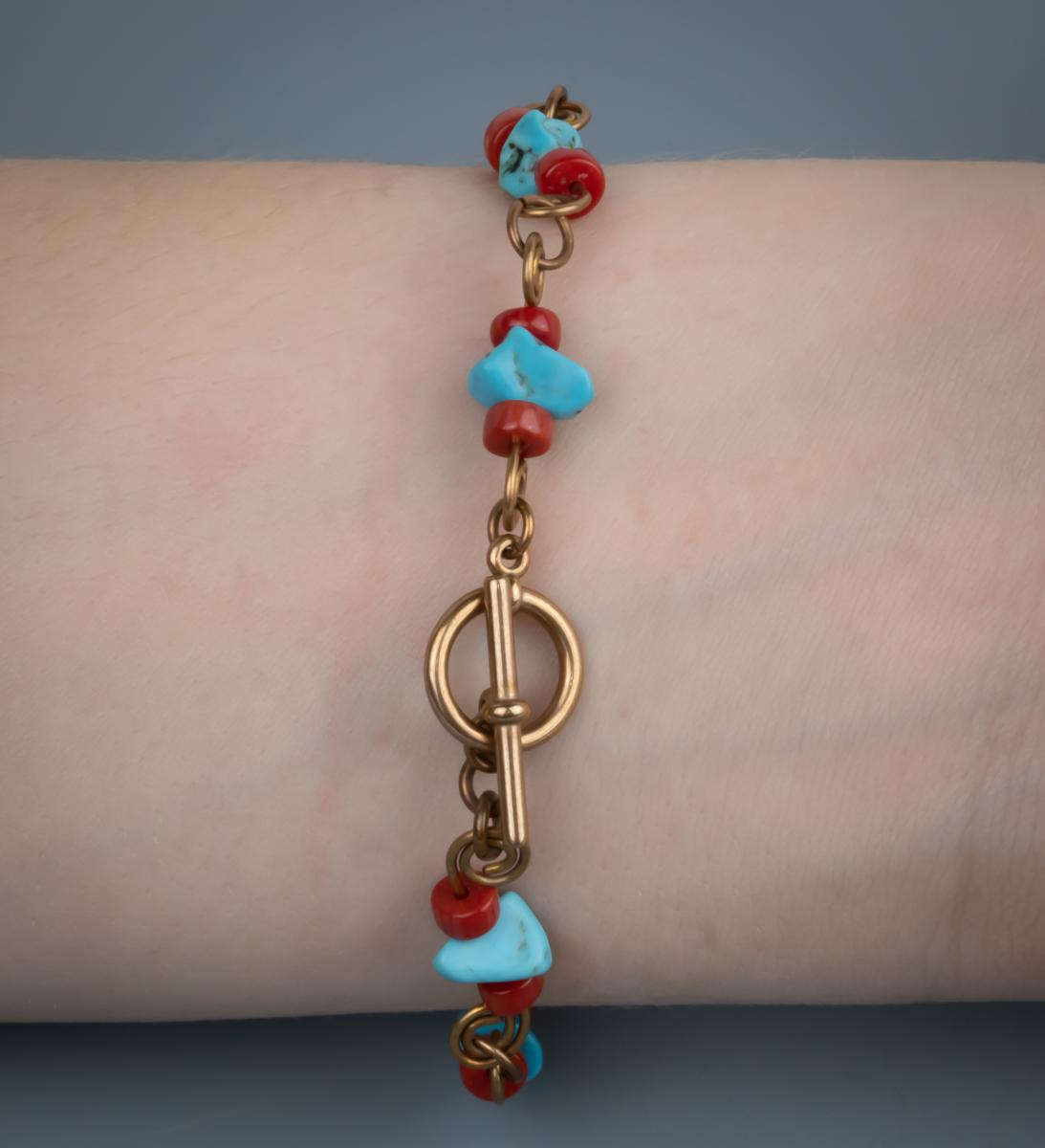 Turquoise, red coral, bronze wire work bracelet picture