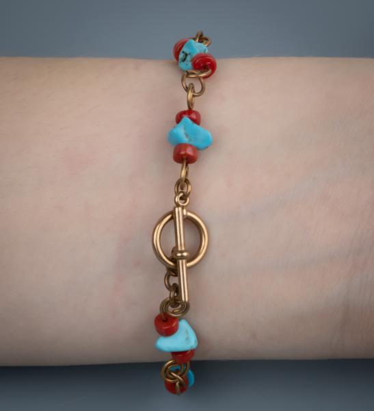 Turquoise, red coral, bronze wire work bracelet picture