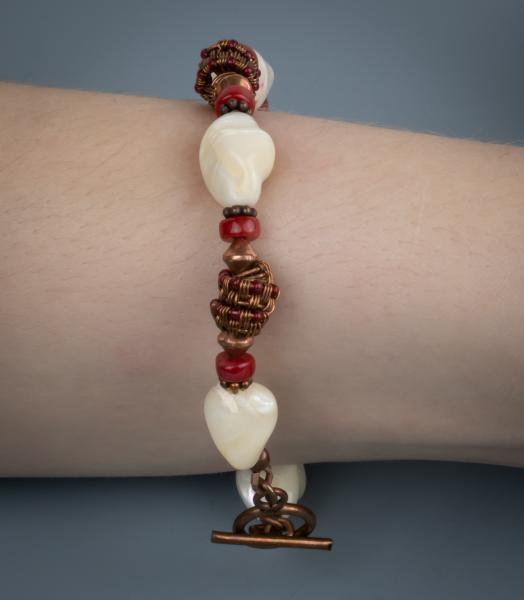 Mother of pearl, red coral, copper woven bracelet picture