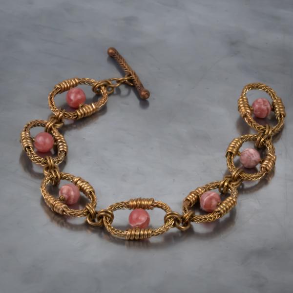 Rhodochrosite bronze braided oval bracelet
