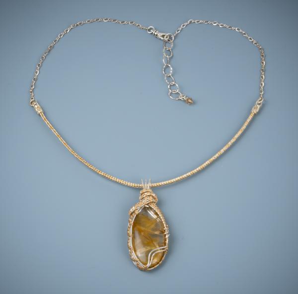Rutilated quartz- silver & gold filled wire woven pendant picture