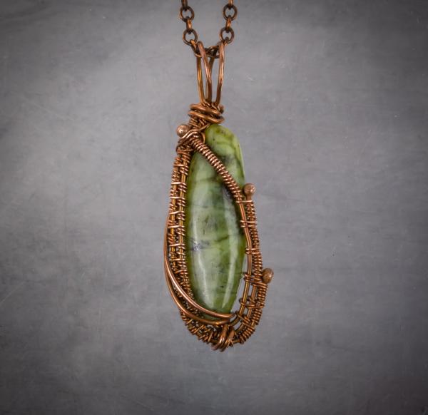 Jade and copper wire woven pendant