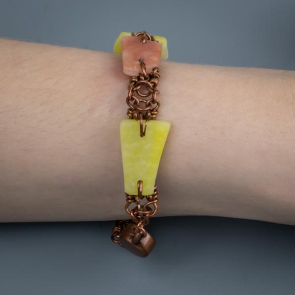 Yellow and orange tumbled glass and copper wire woven bracelet. picture