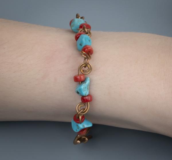 Turquoise, red coral, bronze wire work bracelet picture