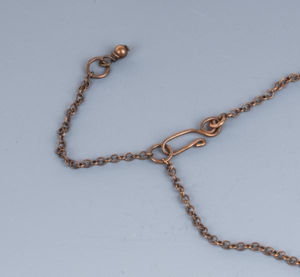 Jade and copper wire woven pendant picture