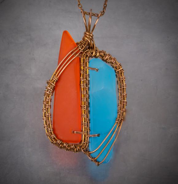 Caribbean blue & orange tumbled glass copper woven pendant