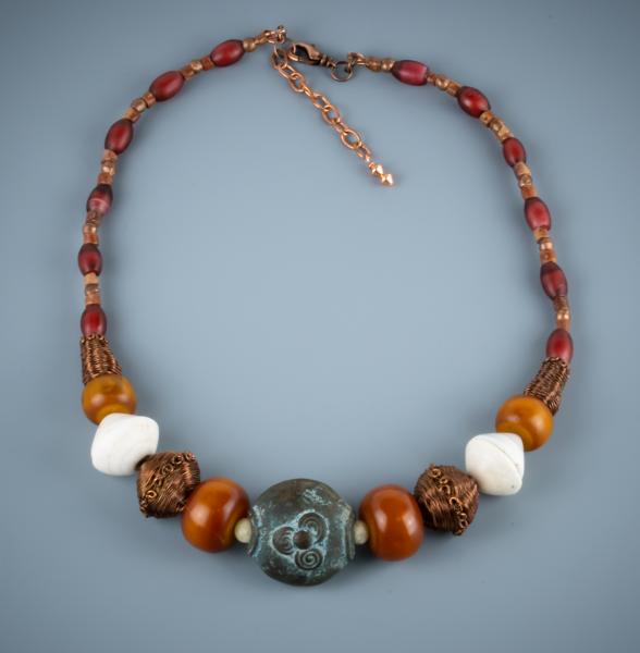 Nigerian bronze, phenolic resin, mauritaian shell, red heart and copper woven bead necklace picture