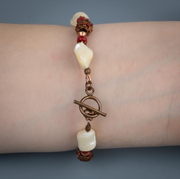 Mother of pearl, red coral, copper woven bracelet picture