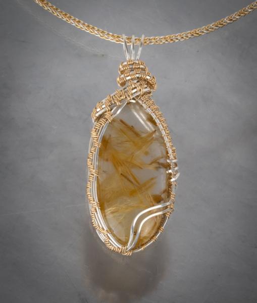 Rutilated quartz- silver & gold filled wire woven pendant