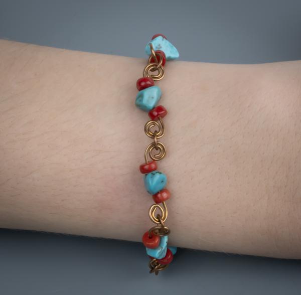 Turquoise, red coral, bronze wire work bracelet picture