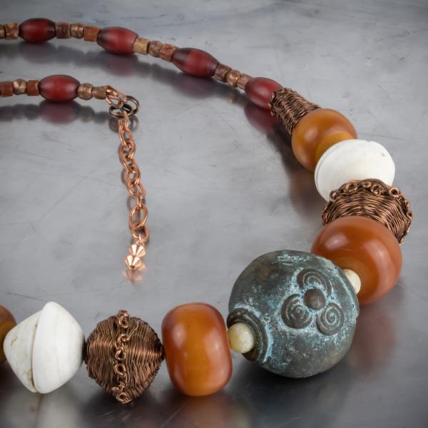 Nigerian bronze, phenolic resin, mauritaian shell, red heart and copper woven bead necklace