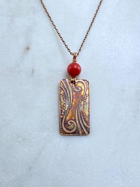 Acid etched copper swirl necklace with coral