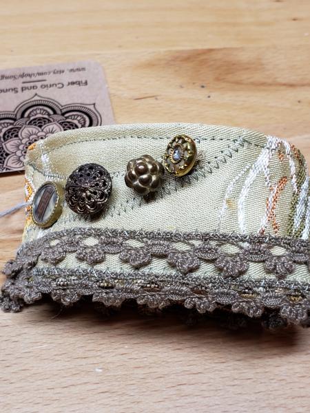 Fabric cuff with vintage buttons