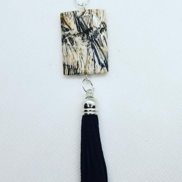 Black & White rectangular stone with black tassle picture