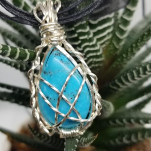 Silver wrapped Turquoise teardrop picture