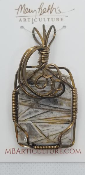 Brass wire wrapped fossil pendant picture