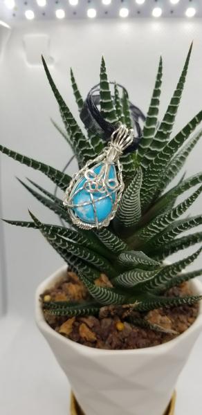 Silver wrapped Turquoise teardrop picture
