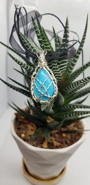 Silver wrapped Turquoise teardrop picture