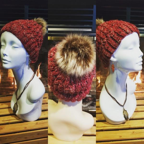 Red twist knit hat with faux fur pom