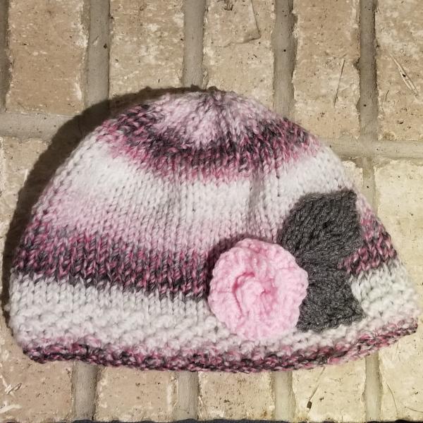 Knit pastel hat with a light pink rose picture