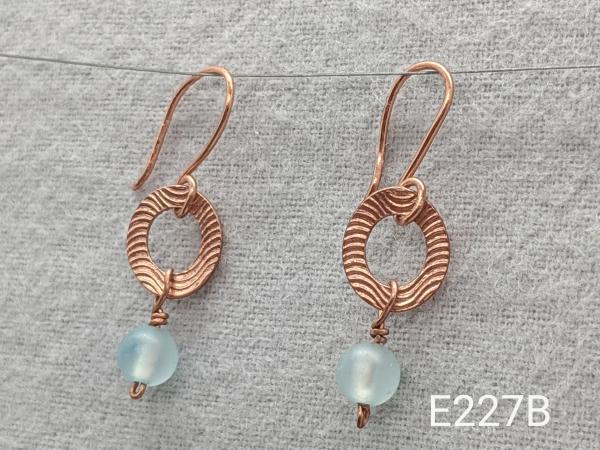 Textured copper earrings with icy jade beads
