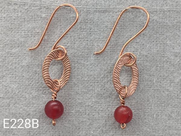 Textured copper earrings with red quartz beads