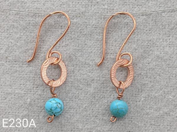 Textured copper earrings with turquoise beads