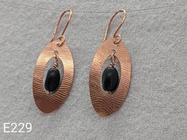 Textured copper earrings with black glass beads